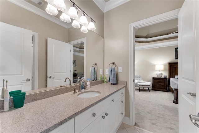 bathroom featuring crown molding and vanity