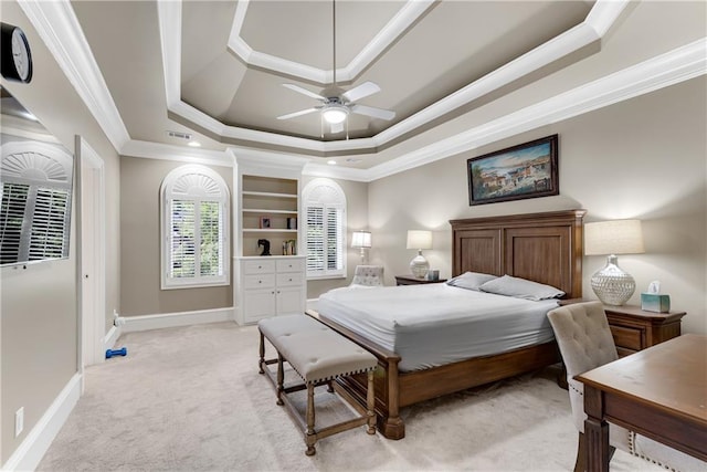 carpeted bedroom with crown molding, a raised ceiling, and ceiling fan