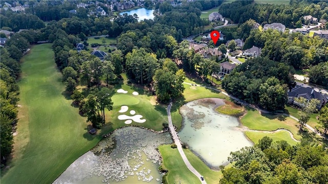 bird's eye view with a water view and golf course view