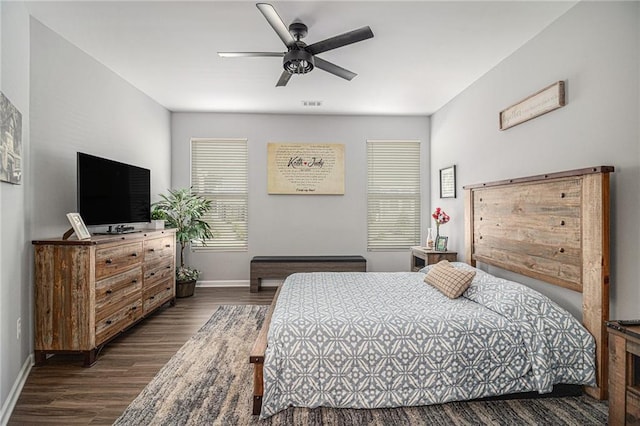 bedroom featuring ceiling fan and dark hardwood / wood-style floors