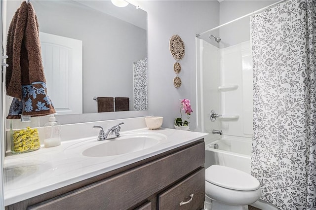 full bathroom featuring shower / bath combination with curtain, vanity, and toilet