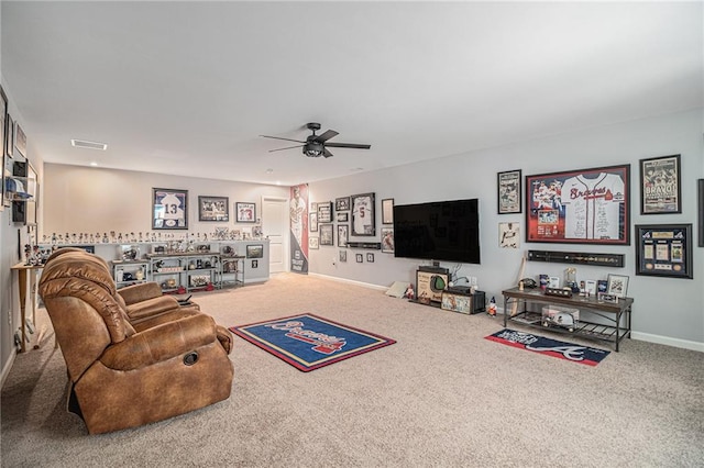 living room featuring carpet floors and ceiling fan