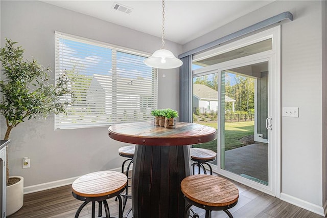 dining room with dark wood-type flooring