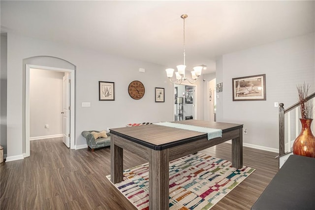 recreation room with an inviting chandelier and dark wood-type flooring