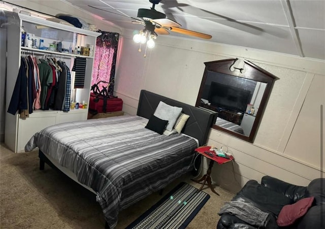 carpeted bedroom featuring ceiling fan and a closet