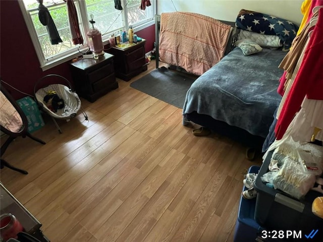 bedroom featuring light wood-style floors