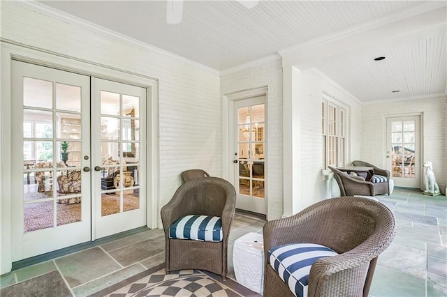 sunroom / solarium featuring french doors
