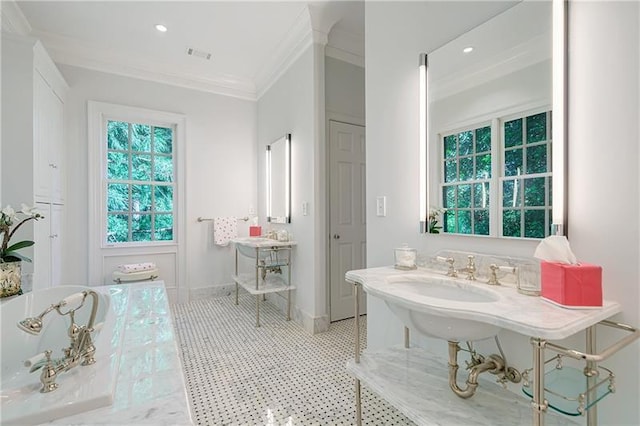 full bathroom with crown molding, a freestanding tub, tile patterned floors, baseboards, and recessed lighting