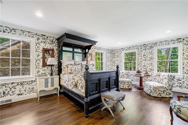 bedroom featuring wallpapered walls, wood finished floors, baseboards, ornamental molding, and recessed lighting