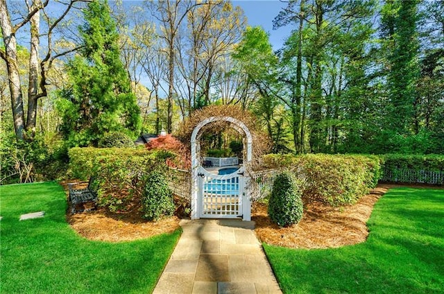 view of home's community with a lawn