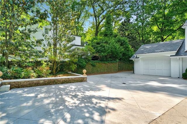 garage featuring driveway