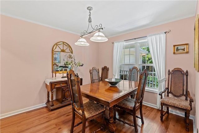 5584 Northwoods Rd, Clermont, GA 30527 - dining space with baseboards, light wood-type flooring, and crown molding