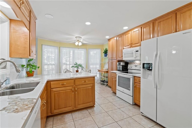 5584 Northwoods Rd, Clermont, GA 30527 - kitchen with white appliances, a sink, a peninsula, decorative backsplash, and ceiling fan