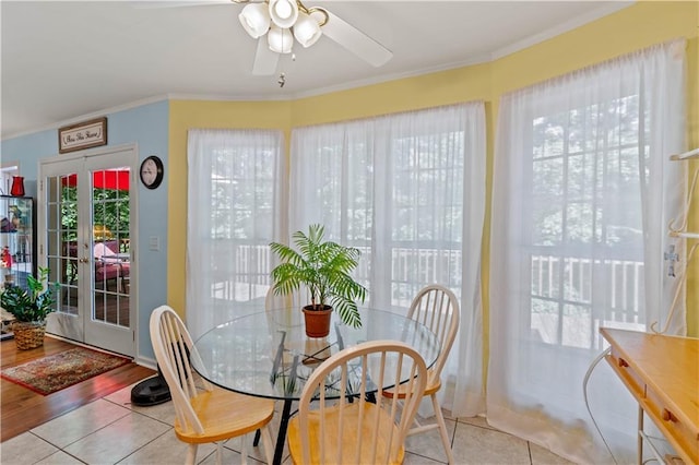 5584 Northwoods Rd, Clermont, GA 30527 - dining area with crown molding, a ceiling fan, and tile patterned flooring