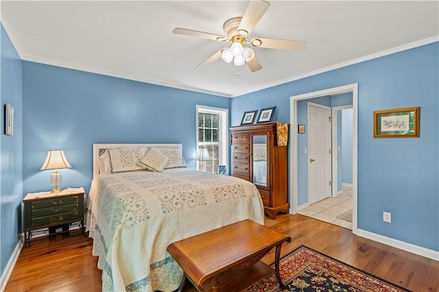5584 Northwoods Rd, Clermont, GA 30527 - bedroom with wood-type flooring, baseboards, crown molding, and ceiling fan