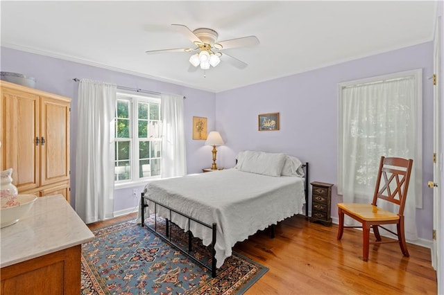 5584 Northwoods Rd, Clermont, GA 30527 - bedroom with light wood finished floors, ornamental molding, ceiling fan, and baseboards