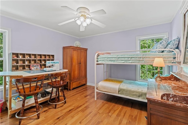 5584 Northwoods Rd, Clermont, GA 30527 - bedroom with light wood-type flooring, ornamental molding, and ceiling fan