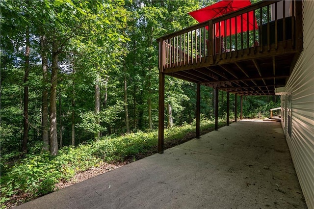5584 Northwoods Rd, Clermont, GA 30527 - view of patio / terrace with a wooden deck and a wooded view