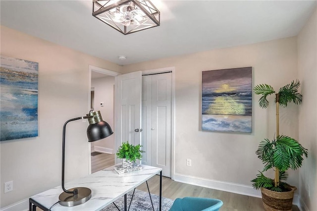 office featuring baseboards and light wood-style floors