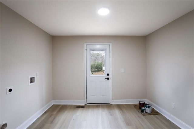 interior space featuring visible vents, baseboards, and light wood-style flooring