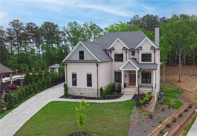 1525 Tapestry Rdg, Lawrenceville, GA 30045 - craftsman-style house with a porch, driveway, a chimney, a front yard, and central AC unit