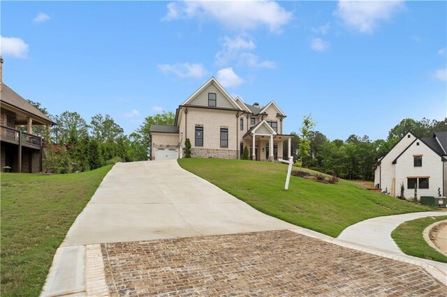 1525 Tapestry Rdg, Lawrenceville, GA 30045 - view of front of house featuring a garage, a front yard, brick siding, central air condition unit, and driveway