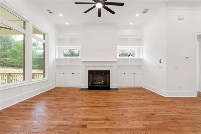 1525 Tapestry Rdg, Lawrenceville, GA 30045 - unfurnished living room with baseboards, ceiling fan, a fireplace with raised hearth, and visible vents