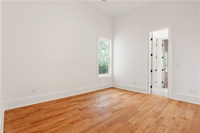 1525 Tapestry Rdg, Lawrenceville, GA 30045 - spare room featuring baseboards and wood finished floors