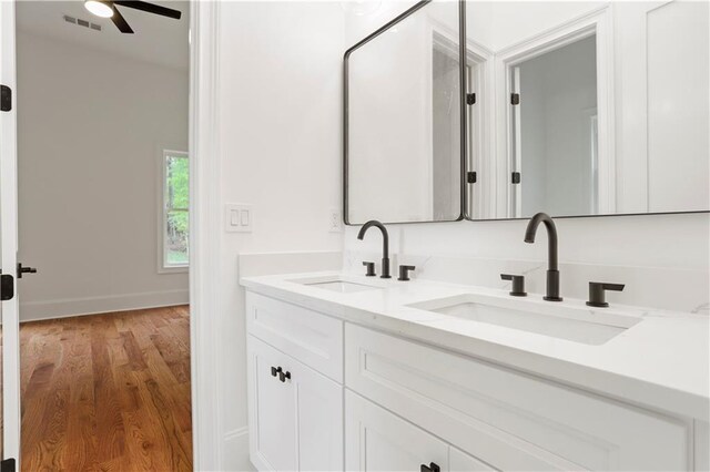 1525 Tapestry Rdg, Lawrenceville, GA 30045 - bathroom with a ceiling fan, visible vents, a sink, and wood finished floors