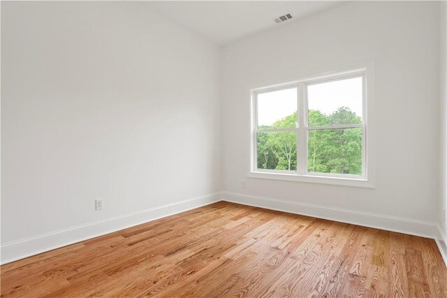 1525 Tapestry Rdg, Lawrenceville, GA 30045 - unfurnished room featuring baseboards, visible vents, and light wood finished floors