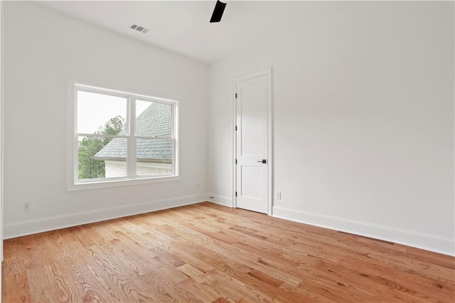 1525 Tapestry Rdg, Lawrenceville, GA 30045 - spare room with visible vents, baseboards, ceiling fan, and light wood-style floors