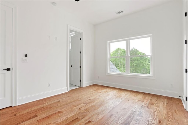 1525 Tapestry Rdg, Lawrenceville, GA 30045 - unfurnished bedroom featuring visible vents, light wood finished floors, and baseboards