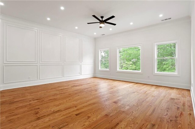 1525 Tapestry Rdg, Lawrenceville, GA 30045 - spare room with visible vents, a decorative wall, recessed lighting, a ceiling fan, and light wood-style flooring