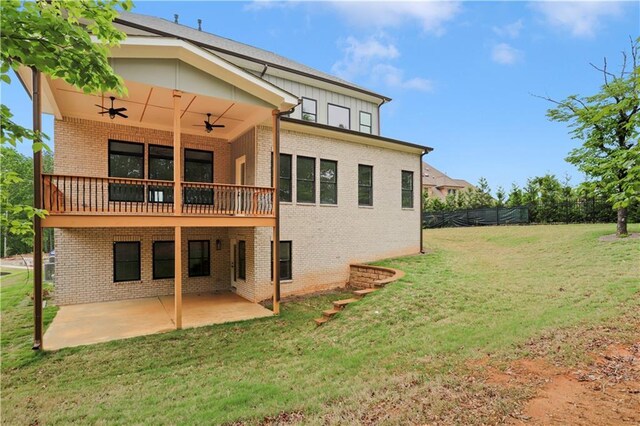 1525 Tapestry Rdg, Lawrenceville, GA 30045 - rear view of property with fence, brick siding, ceiling fan, a patio, and a yard