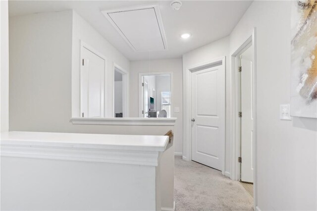 staircase featuring wood-type flooring, crown molding, and an inviting chandelier