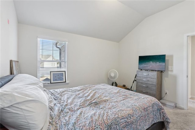 bedroom featuring carpet flooring, baseboards, and lofted ceiling