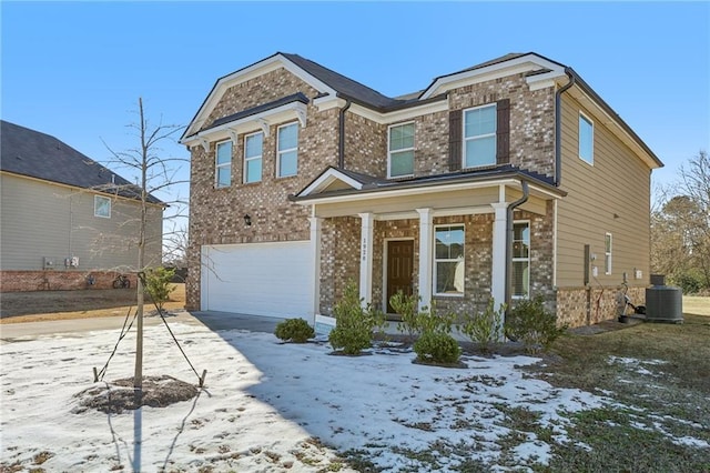 view of front facade with covered porch, concrete driveway, an attached garage, brick siding, and central AC unit