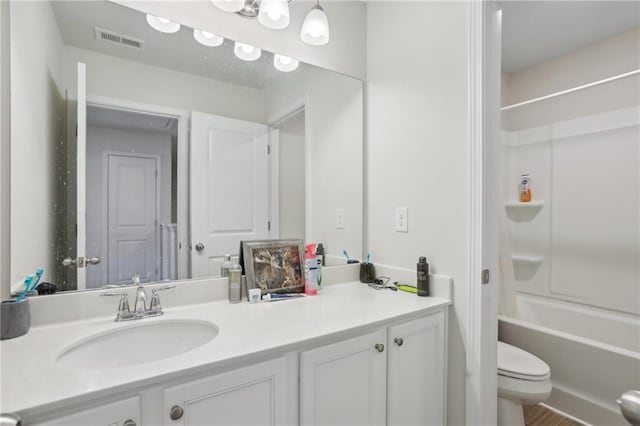 bathroom with vanity, toilet, bathtub / shower combination, and visible vents