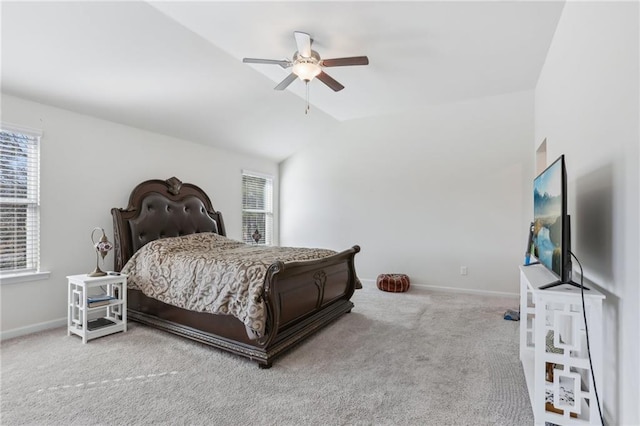 carpeted bedroom with baseboards, lofted ceiling, and a ceiling fan