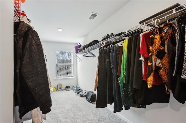 spacious closet with visible vents and carpet