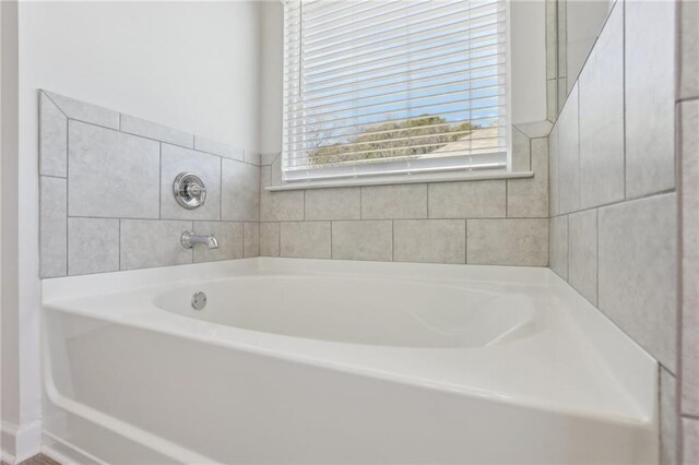 bathroom with a shower with shower door, vanity, vaulted ceiling, and hardwood / wood-style floors