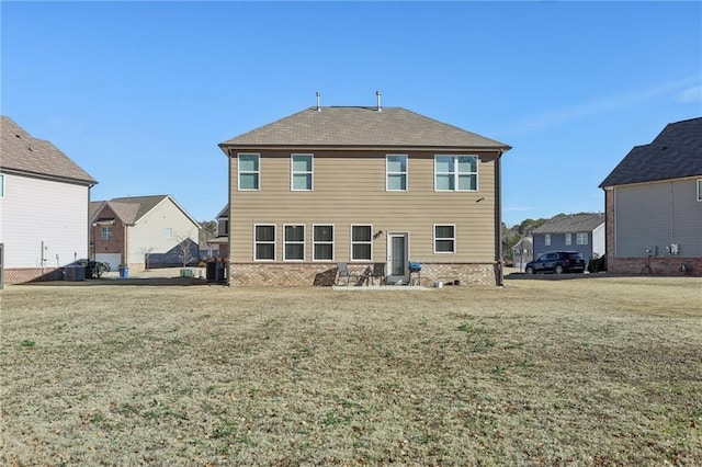 rear view of house featuring a yard and a residential view