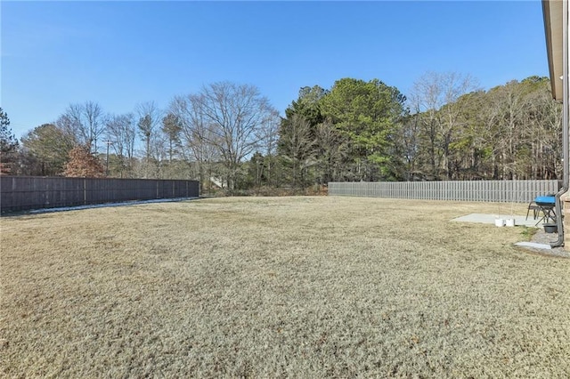 view of yard with a fenced backyard