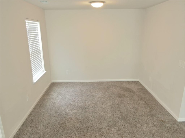 unfurnished room with plenty of natural light and carpet floors