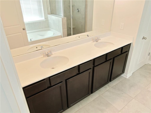 bathroom with separate shower and tub, vanity, and tile patterned floors