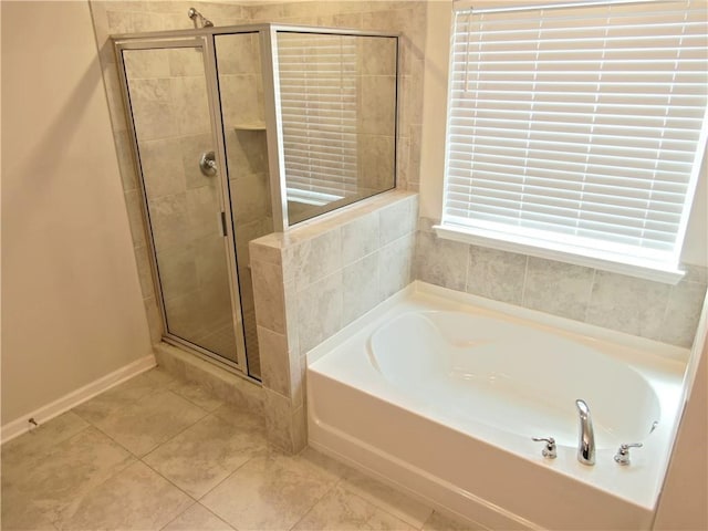 bathroom with shower with separate bathtub and tile patterned floors