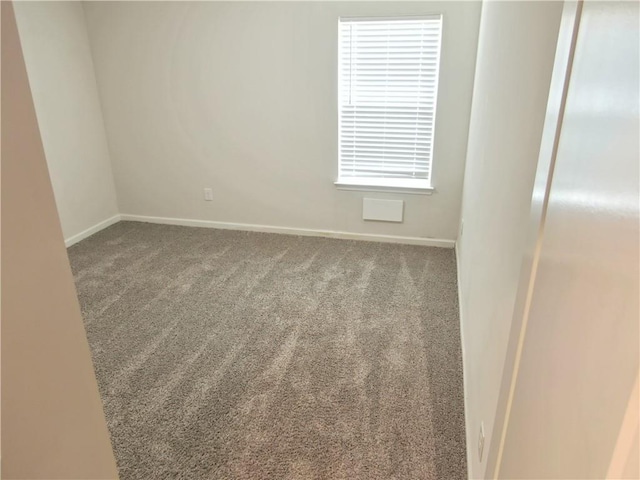 unfurnished room featuring carpet