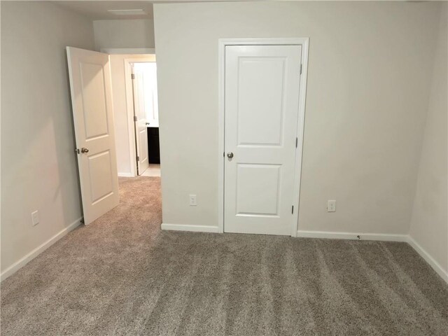 unfurnished bedroom with carpet