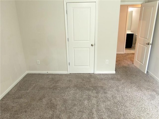 unfurnished bedroom with carpet flooring