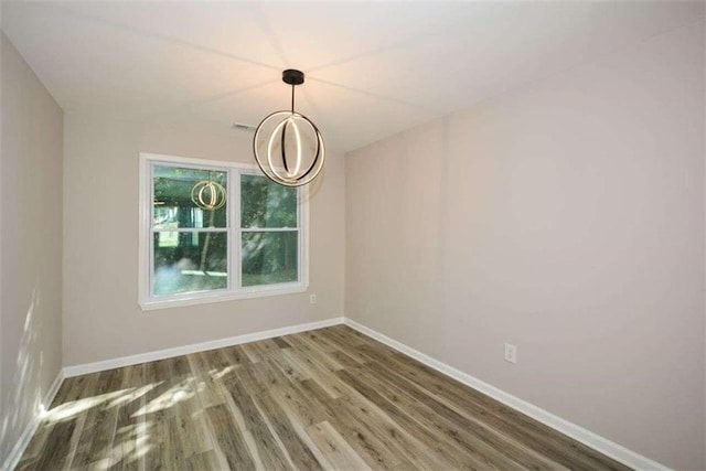 unfurnished dining area with dark hardwood / wood-style flooring